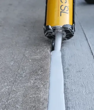 Concrete joint expansion sealant being used for floor joint