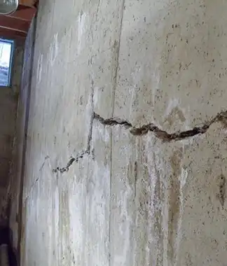 Large structural foundation cement crack needing repair with sealant or mortar