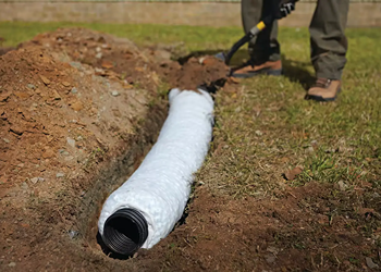 French drain drainage system installation dug outside